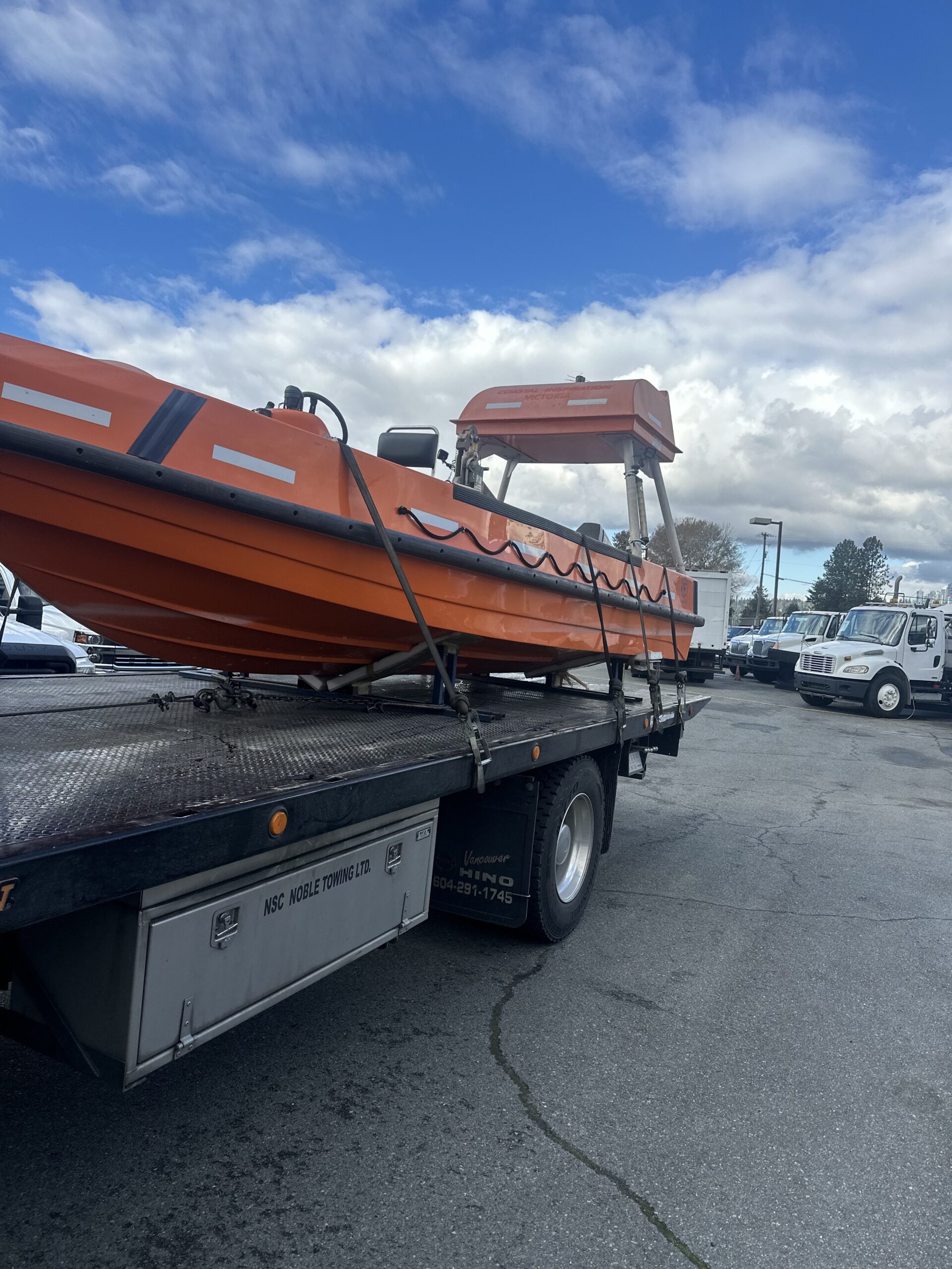 Scrap orange rigid hull lifeboat rescue vessel removal